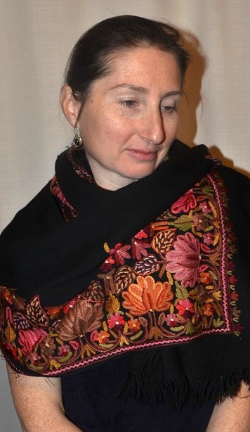 Empar is wearing a stunning Shalimar Gita shawl, black with full surface hand-stitched embroidery